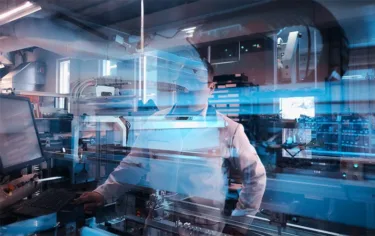 Operator watching machine process